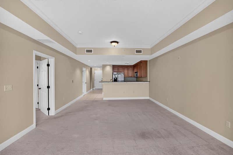 Living room with carpet opening to kitchen at 1478 Riverplace Blvd 1904, Jacksonville, FL 32207