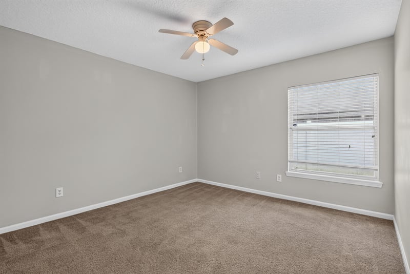 Empty carpeted room with window at 11669 Collins Creek Dr, Jacksonville, FL 32258