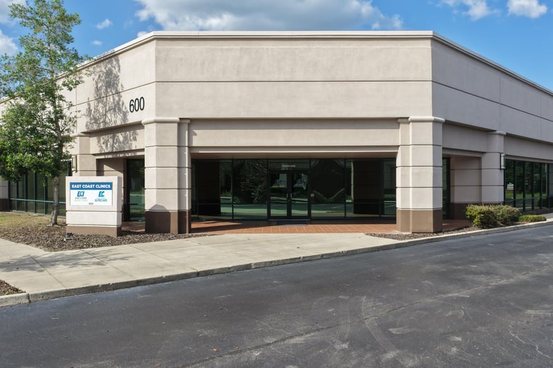 Building front with 600 address sign and entry doors at 10550 Deerwood Park Blvd, Jacksonville, FL 32256