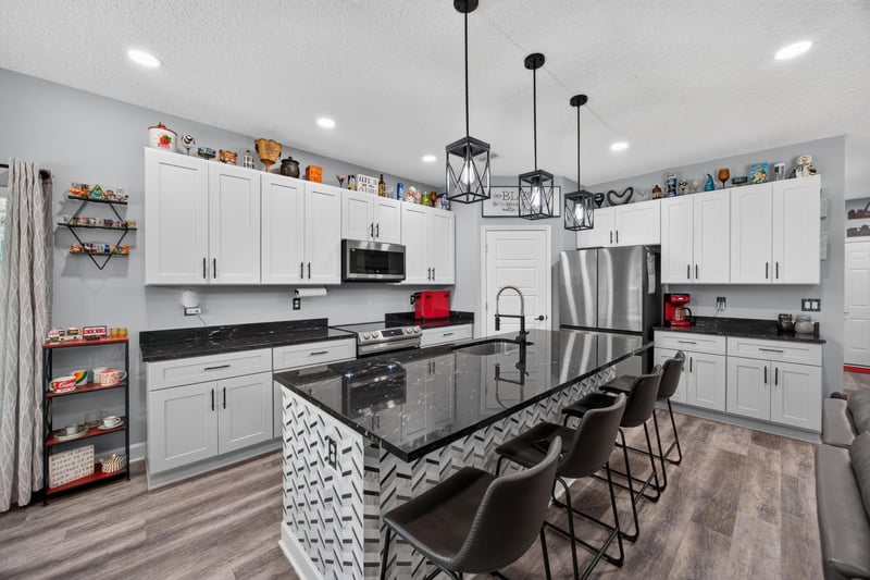 Kitchen with stainless refrigerator and center island at 2817 Camel Cir, Middleburg, FL