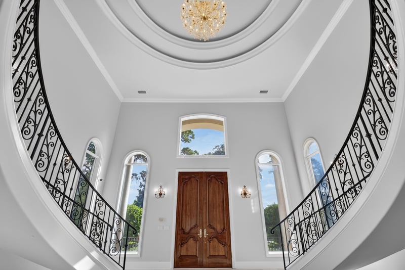 Foyer domed ceiling and curved staircase railings at 344 Broward Rd, Jacksonville, FL