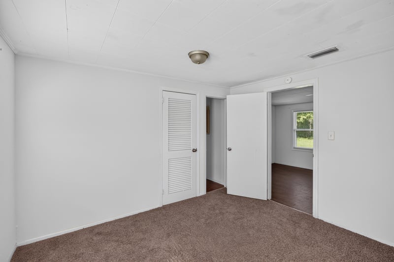 Bedroom with carpet and double closets at 2372 2nd Ave, Jacksonville, FL 32208