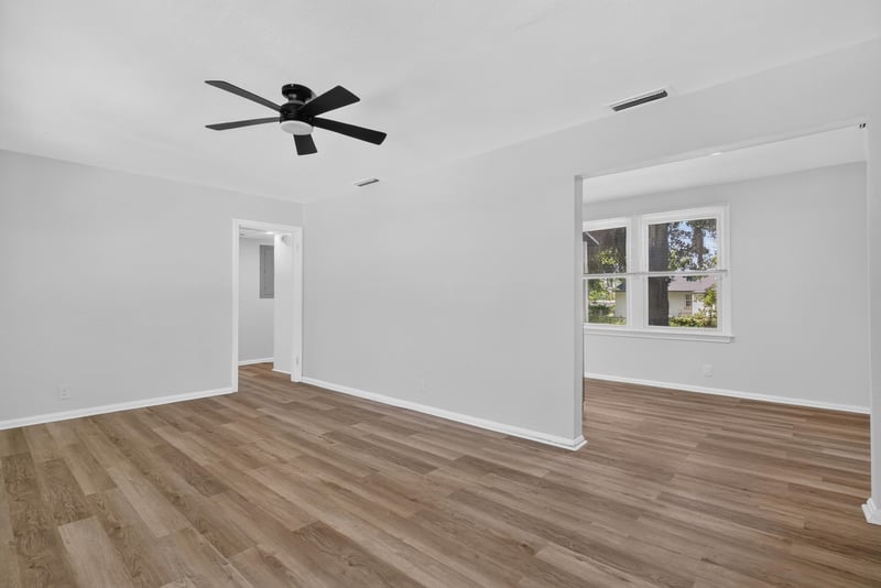 Living room with ceiling fan and wood-look flooring at 855 Cornwallis Dr, Jacksonville, FL