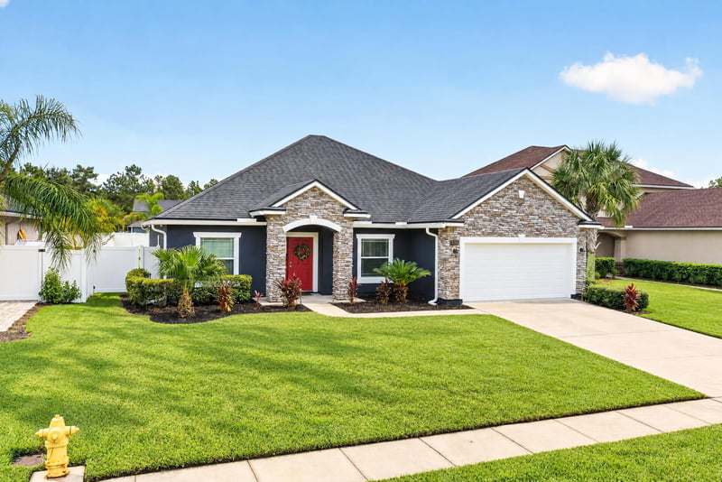Front exterior side angle with stone trim at 538 Porta Rosa Circle, St. Augustine, FL 32092