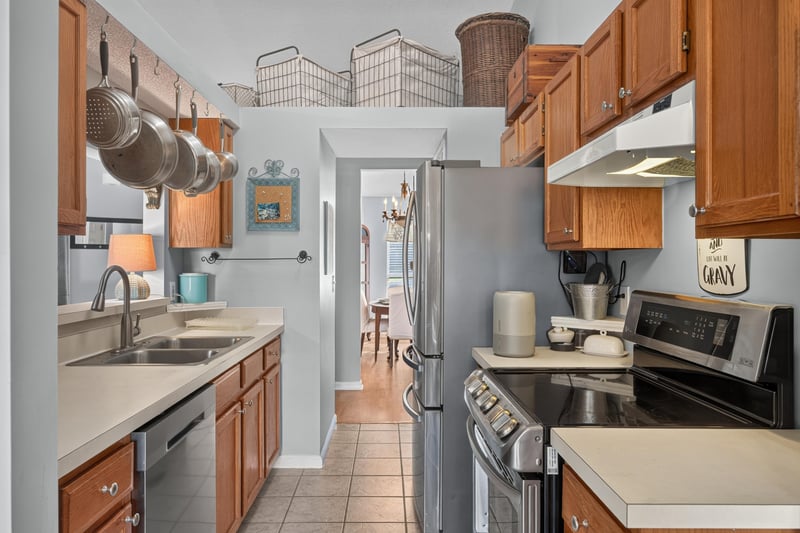 Kitchen cooktop and hallway view at 4556 Shaky Leaf Ln N, Jacksonville, FL 32224