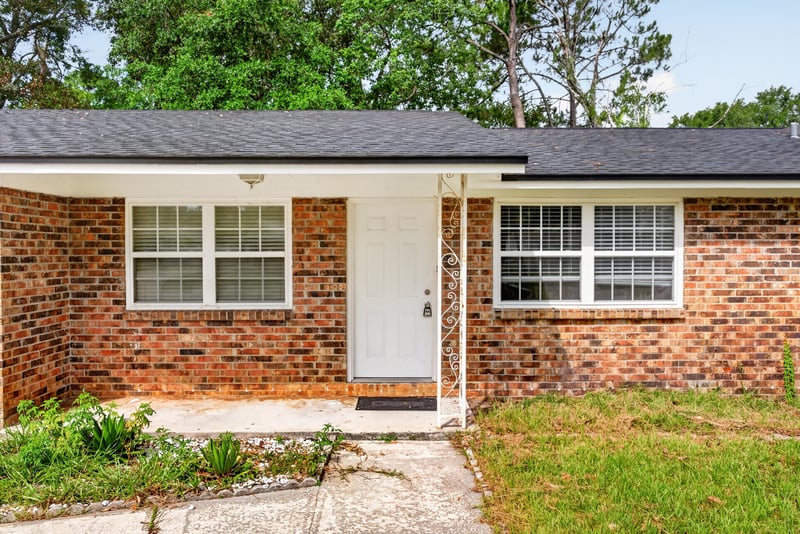 Front entry door and brick facade at 9954 Larkdale Ct, Jacksonville, FL 32257