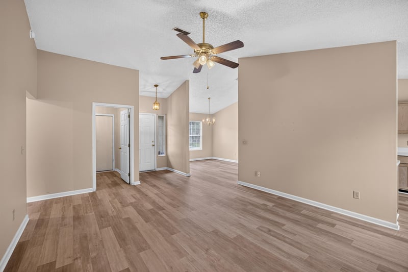 Hallway with wood-look floors and ceiling fan at 6646 Shiloh Creek Dr