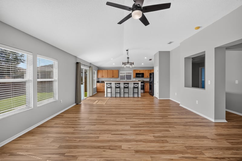 Kitchen bar seating open to living room at 7545 Lirope St, Jacksonville, FL 32244