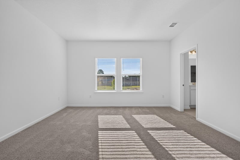Empty carpeted bedroom with window at 269 Bluegrass Wy, St. Augustine, FL 32092