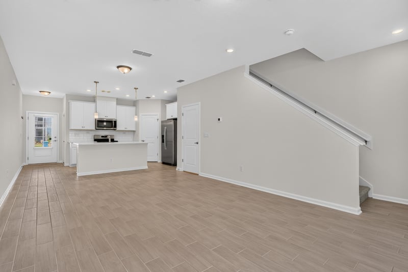 Open kitchen and stairwell at 39 Mellowood Ln, St. Augustine, FL 32092