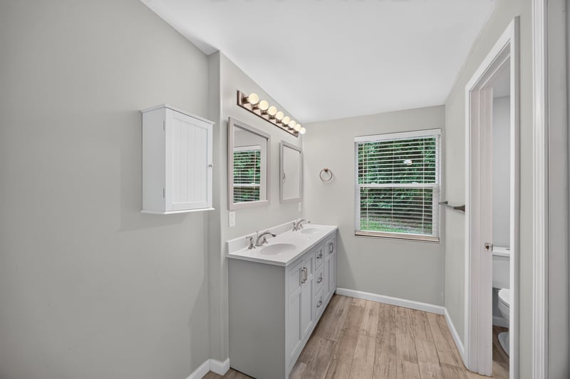 Bathroom, single vanity and wood-look floor at 2256 Inwood Cir S, Jacksonville, FL