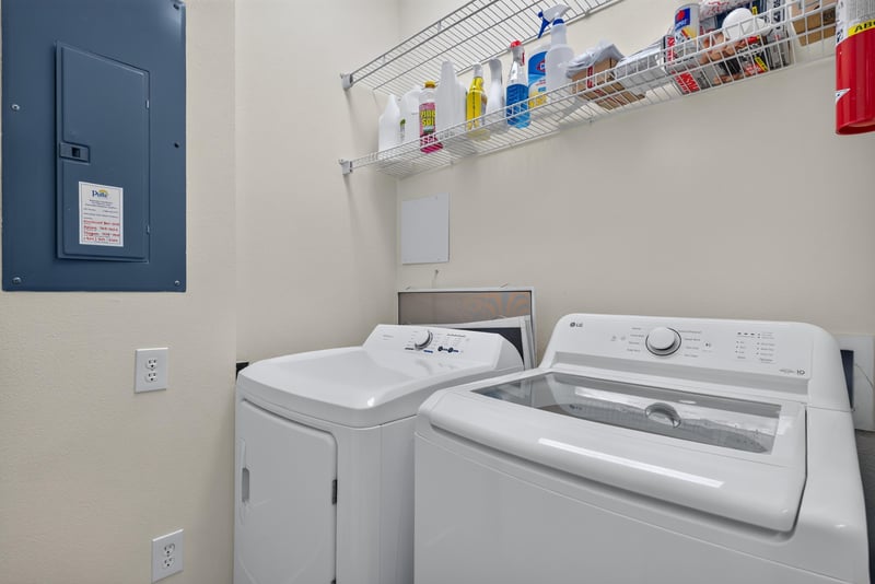 Laundry closet with stacked washer and dryer at 11251 Campfield Dr unit 1202, Jacksonville, FL 32256