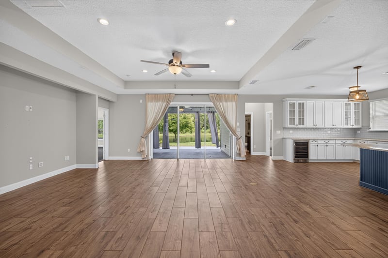 Open living area with windows and wood flooring at 53 Lumen Ct, St. Augustine, FL 32095