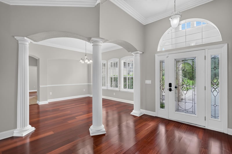 Entry hall with arched ceiling and glass front door at 4109 Eagle Landing Pkwy, Orange Park, FL 32065