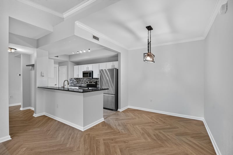 Kitchen with peninsula and pendant light at 10075 Gate Pkwy unit 1905, Jacksonville, FL 32246