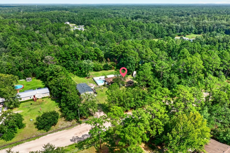 Aerial view of nearby homes and pools in Middleburg, FL