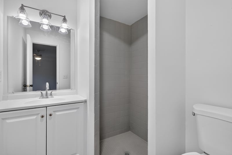 Bathroom vanity with white cabinets at 8177 Virgo St, Jacksonville, FL 32216