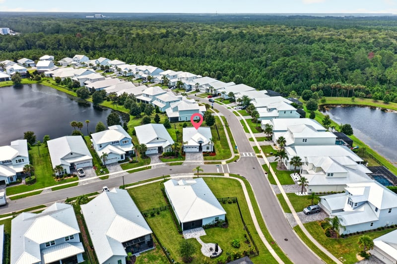 Aerial with 91 Tilloo Ct pinned between two ponds in Beachwalk, St. Johns, FL