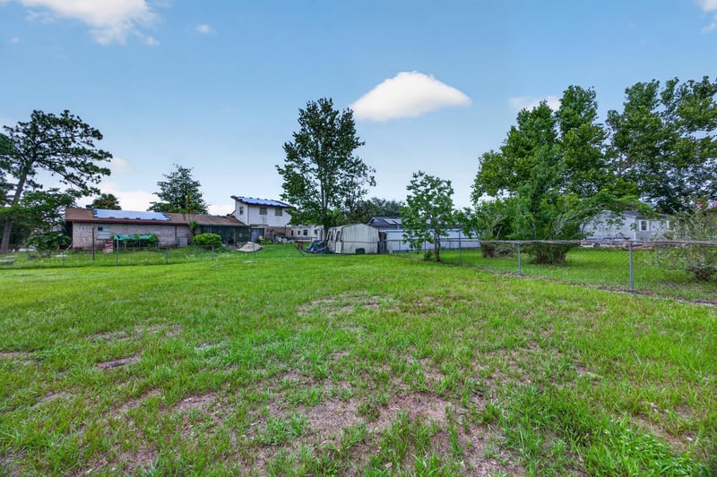 Open backyard with grass and trees at 1143 Tumbleweed Dr, Orange Park, FL 32065