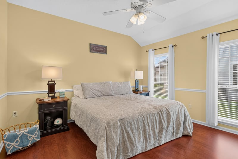 Bedroom with yellow walls and ceiling fan at 2304 Spring Hill Ct, Orange Park, FL