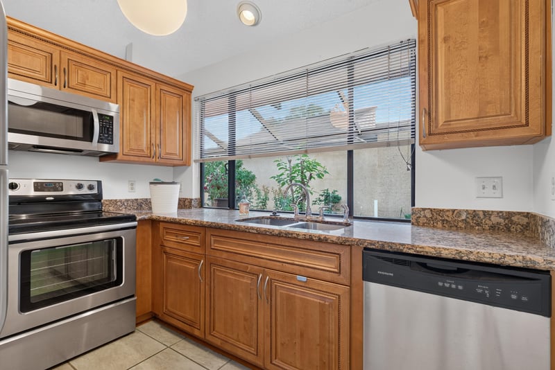 Kitchen with stainless appliances and granite counters at 3515 Cormorant Branch Ct, Jacksonville, FL