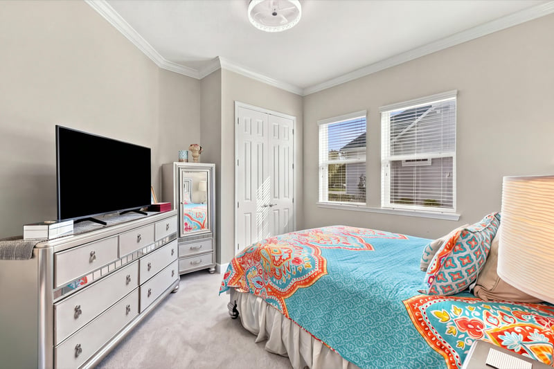 Secondary bedroom with dresser, photographed by Megapixeler on Lucena Ln, Jacksonville, FL