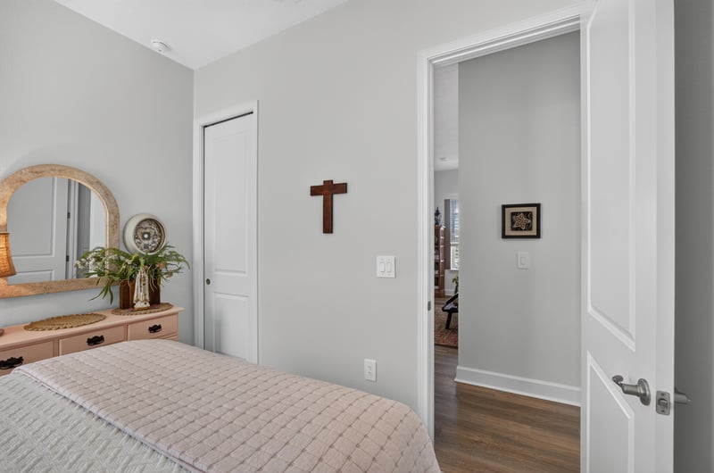 Bedroom with dresser and wall decor at 129 Amberwood Dr, St. Augustine, FL