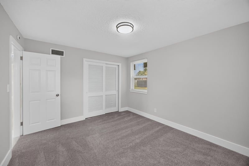 Hallway with closet doors at 6238 Randia Dr, Jacksonville, FL 32210