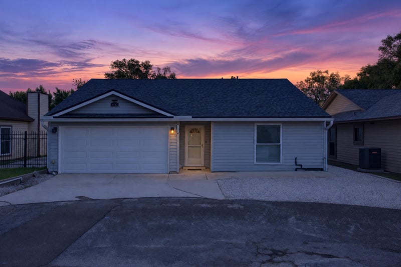Front exterior day-to-dusk view, photographed by Megapixeler on Birch Run E, Orange Park