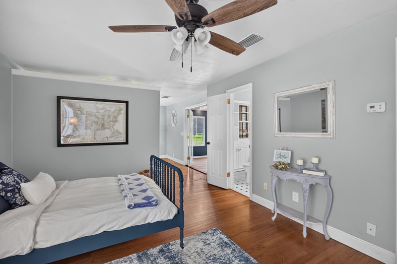 Bedroom with map wall art and ceiling fan at 5843 Ovella Rd, Jacksonville, FL 32244