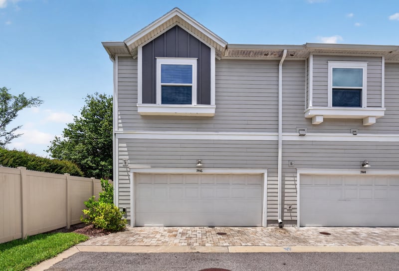 Front exterior with two-car garage at 7446 Loggerhead Ct, Jacksonville, FL 32256