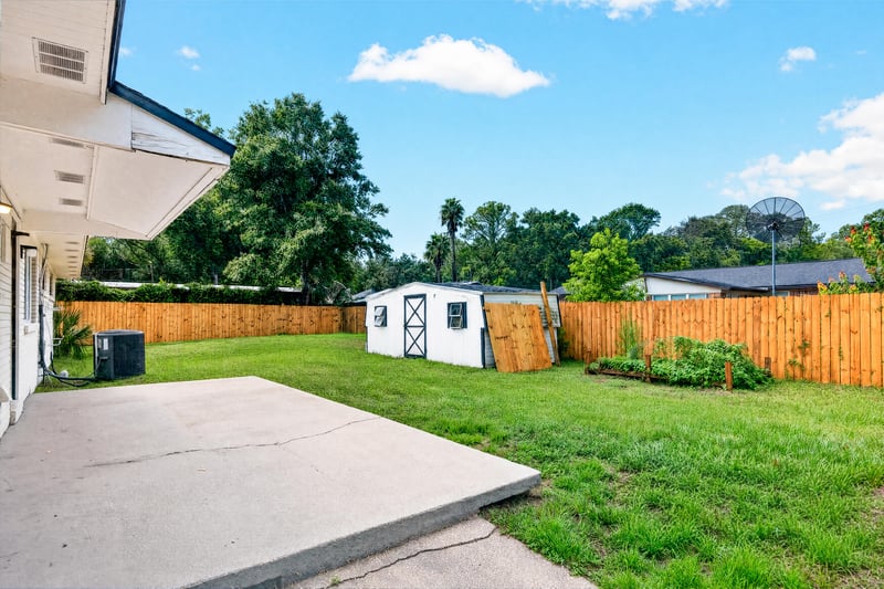 Backyard patio and storage shed at 9506 Harriet Ave, Jacksonville, FL 32208