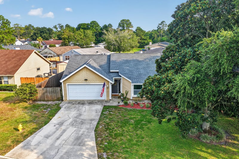 Aerial front exterior view with street at 13020 Medford Ln, Jacksonville, FL 32225