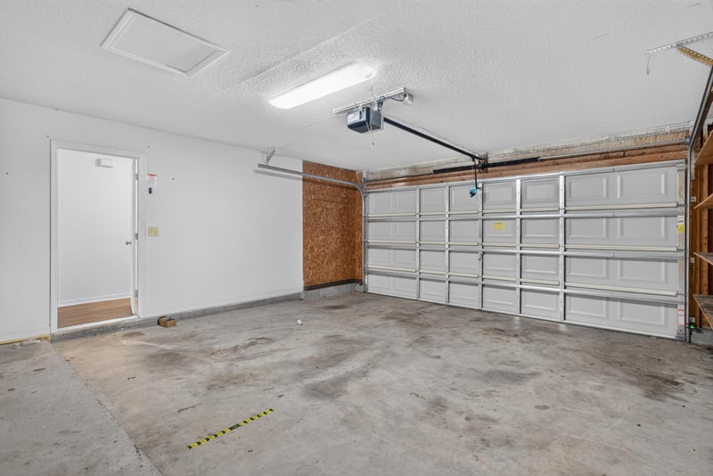 Two-car garage interior at 1445 Classic Oak Rd W, Jacksonville, FL