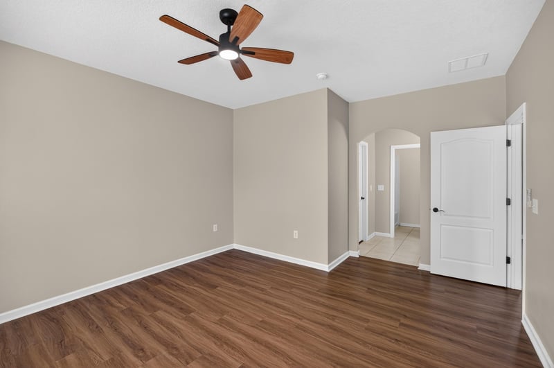 Bedroom with ceiling fan and closet doors at 3750 Silver Bluff Blvd, Orange Park, FL