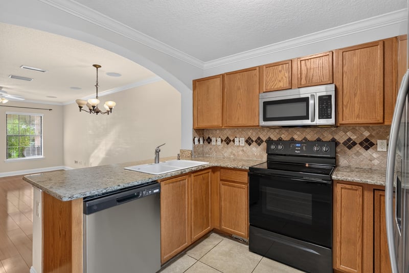 Kitchen breakfast bar with pendant lighting at 353 Redwood Ln