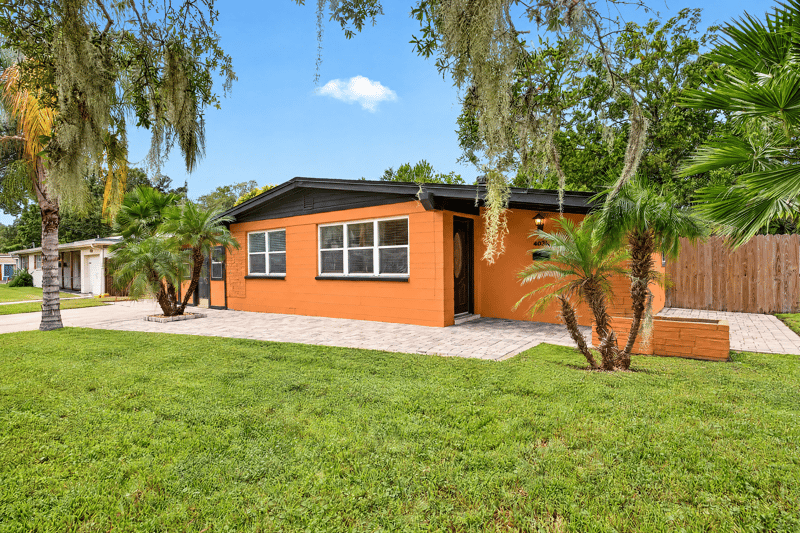 Front exterior, orange house and landscaping at 4039 Habana Ave, Jacksonville, FL