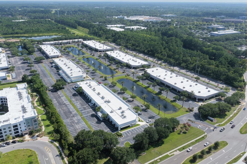 Aerial view of office buildings and pond at 10550 Deerwood Park Blvd, Jacksonville, FL 32256
