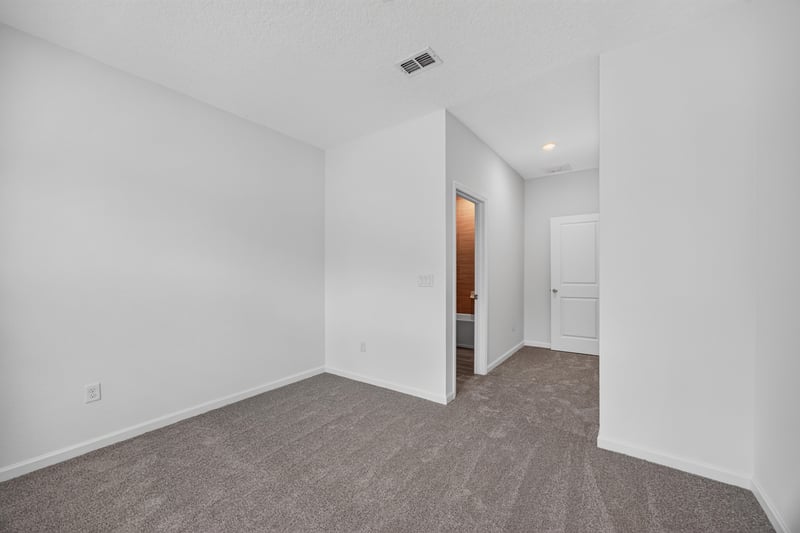Bedroom with closet and hallway doorway at 9905 Ansley Lake Dr, Jacksonville, FL