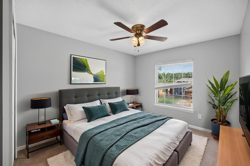 Bedroom staged with bed and nightstand at 470 Sparrow Branch Cir, Jacksonville, FL 32259