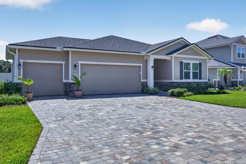 Front exterior with garage and landscaping at 855 Flach Dr, St. Johns, FL