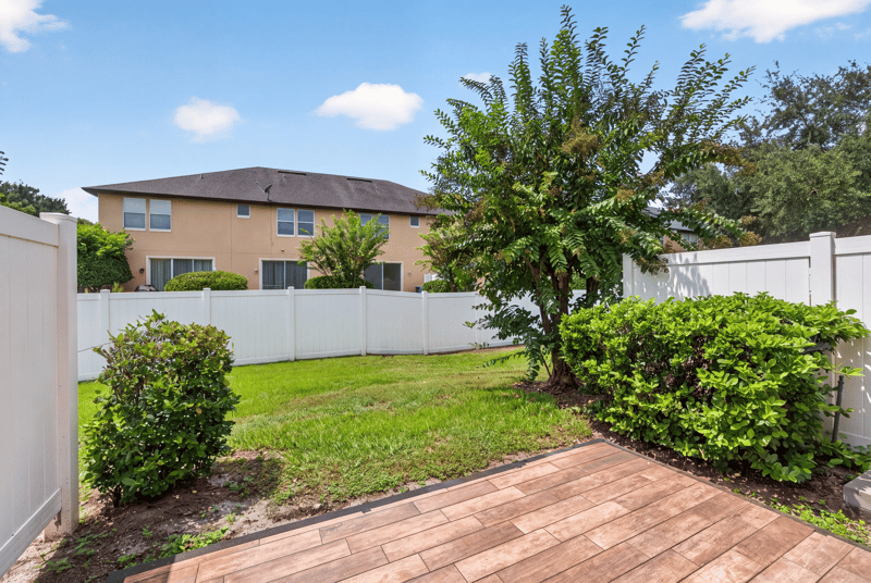 Fenced backyard patio and lawn at 3762 Hartsfield Forest Cir, Jacksonville, FL 32277
