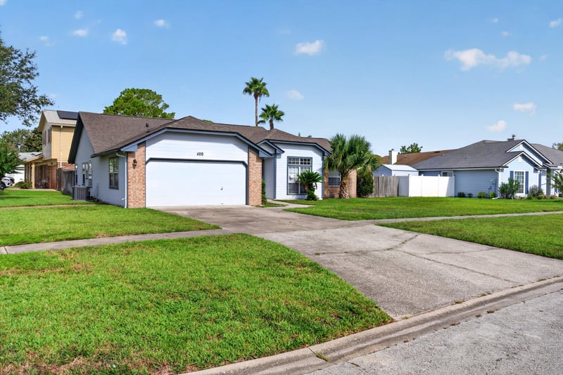Front exterior with garage and driveway at 400 Ashcroft Landing Dr, Jacksonville, FL 32225
