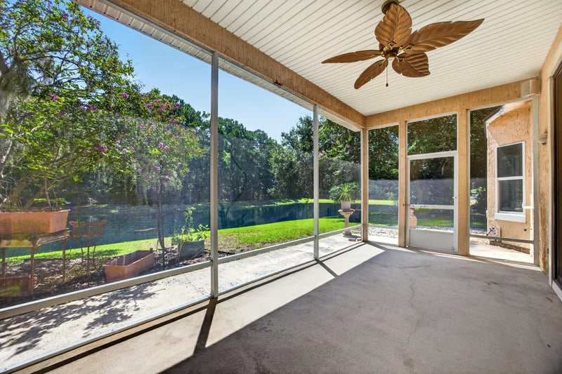 Screened porch overlooking the pond at 11675 Magnolia Estates Rd, Jacksonville, FL 32223