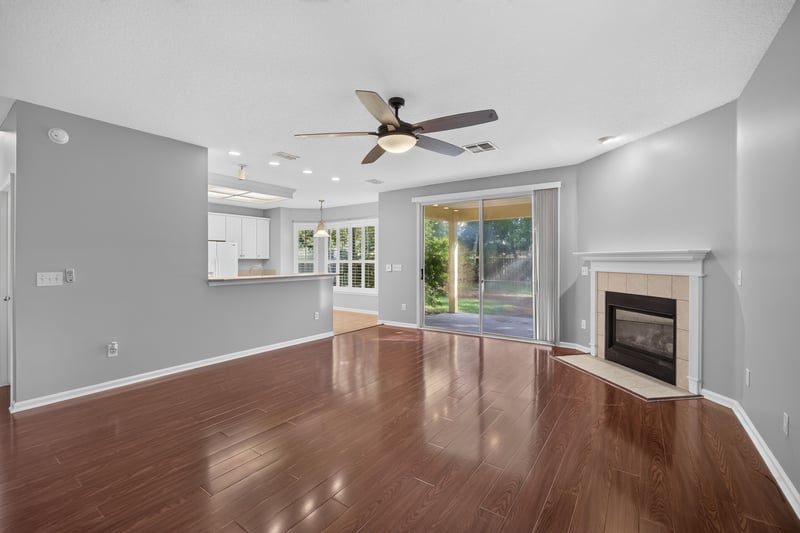 Family room open to kitchen with fireplace at 470 Sparrow Branch Cir, Jacksonville, FL 32259