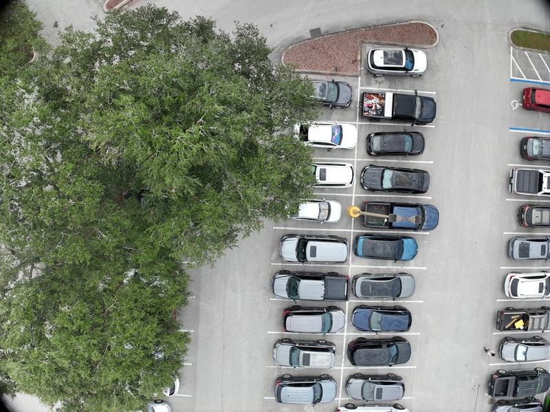 Aerial view of parking lot and tree canopy at 9406 Atlantic Blvd, Jacksonville, FL 32225