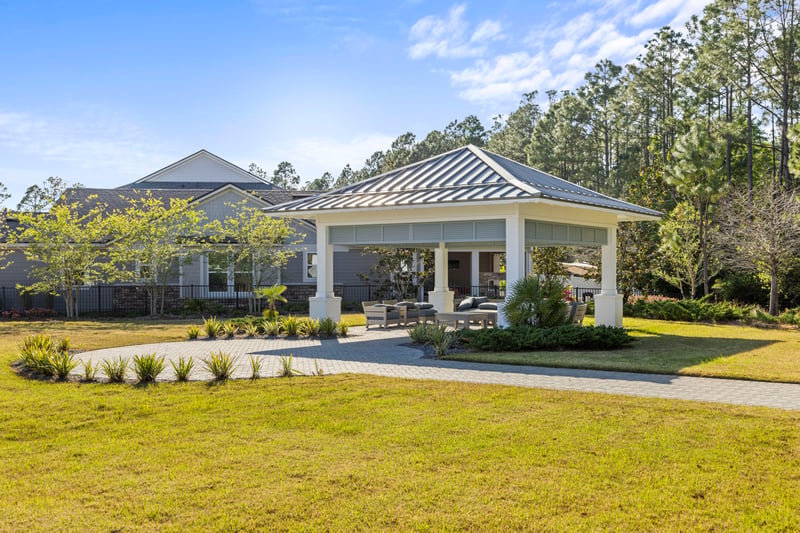 Clubhouse exterior with open lawn in St. Johns, FL