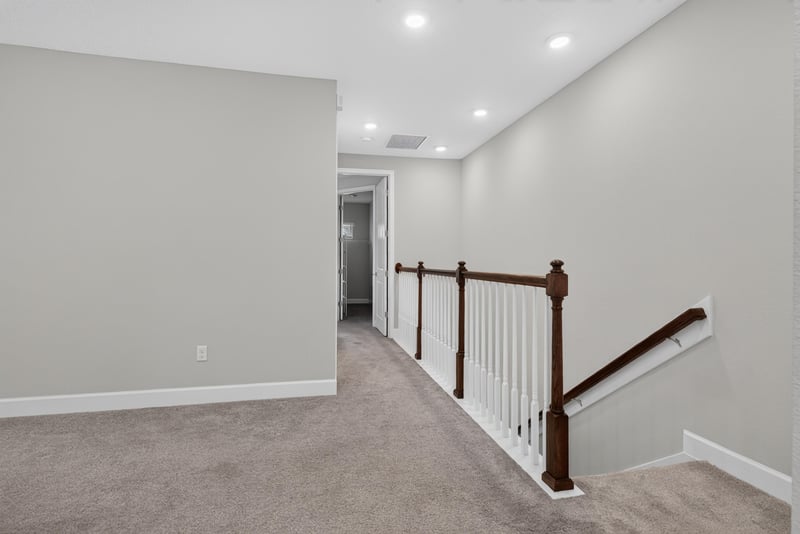 Upstairs landing with staircase at 7446 Loggerhead Ct, Jacksonville, FL 32256