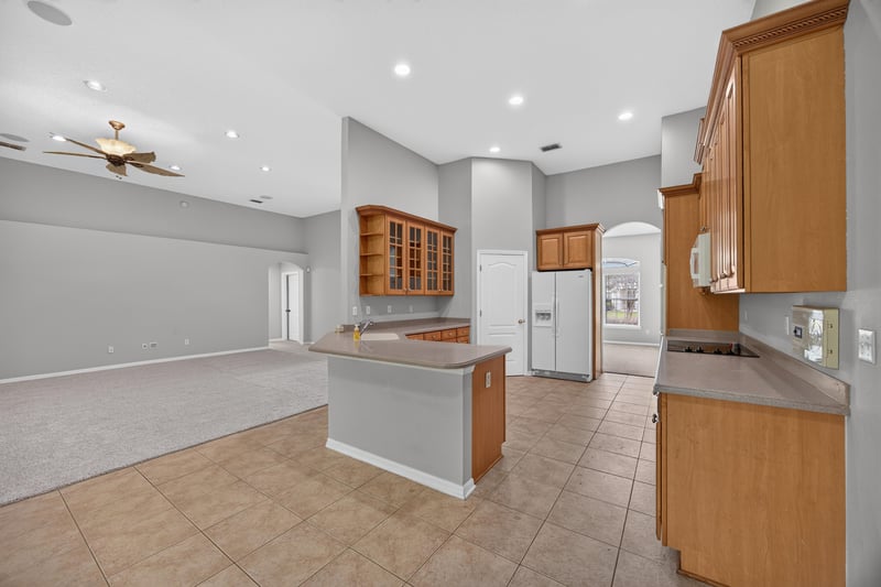 Kitchen with wood cabinets and built-in shelving at 635 Wakeview Dr, Orange Park, FL 32065