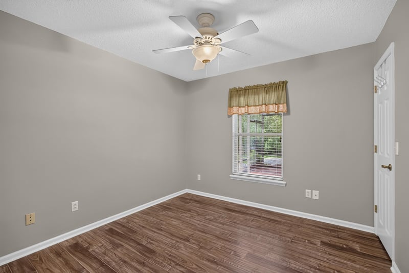 Empty bedroom with wood floor at 1955 GUARDED Way, Fleming Island, FL 32003